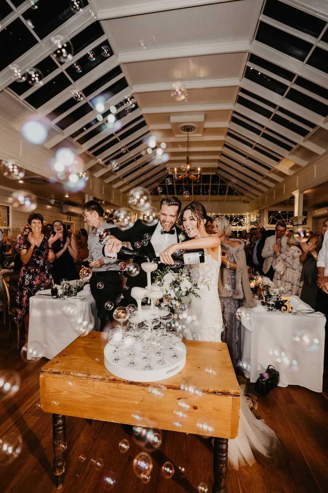 Bride and groom with champagne tower