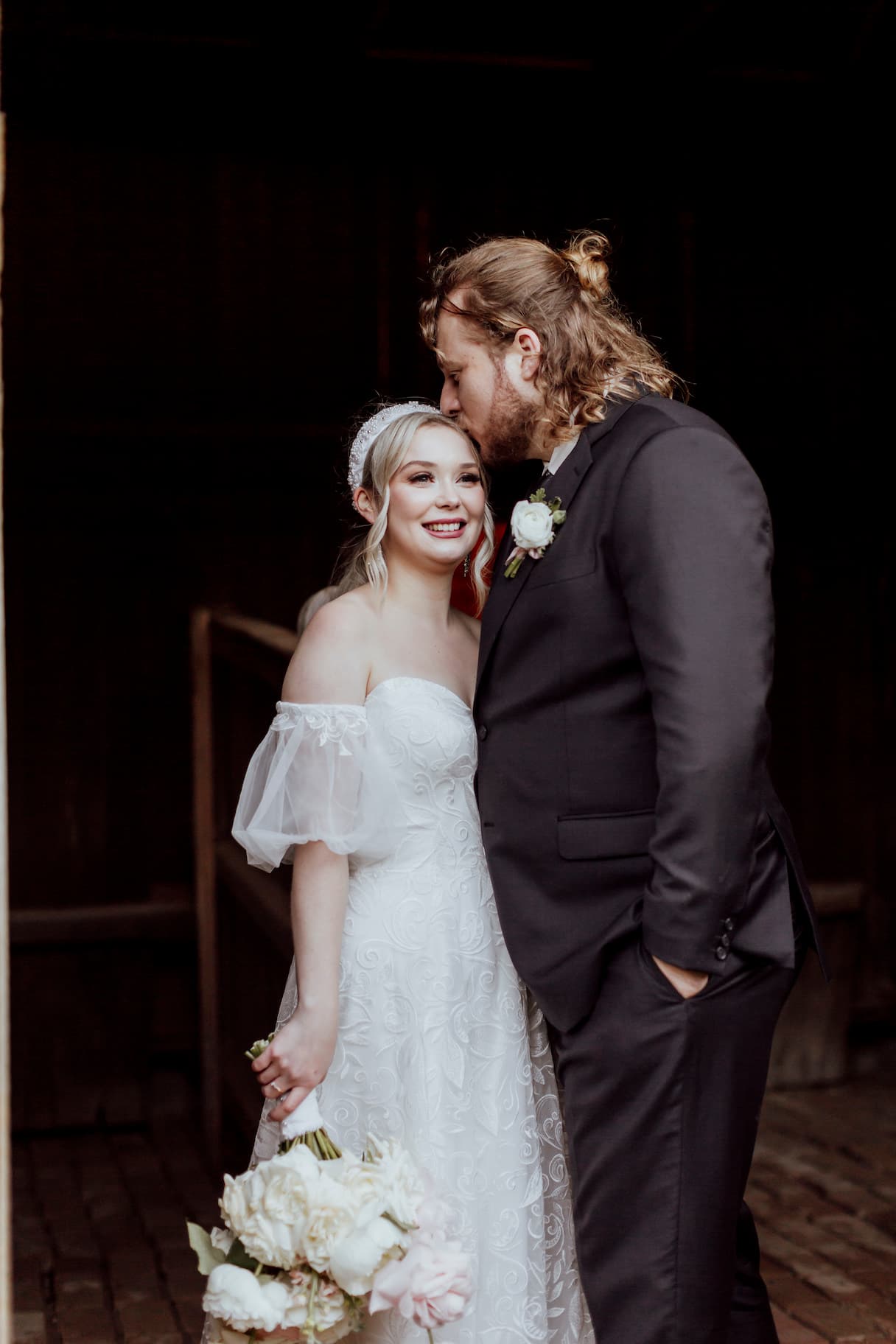 Bride and groom kissing